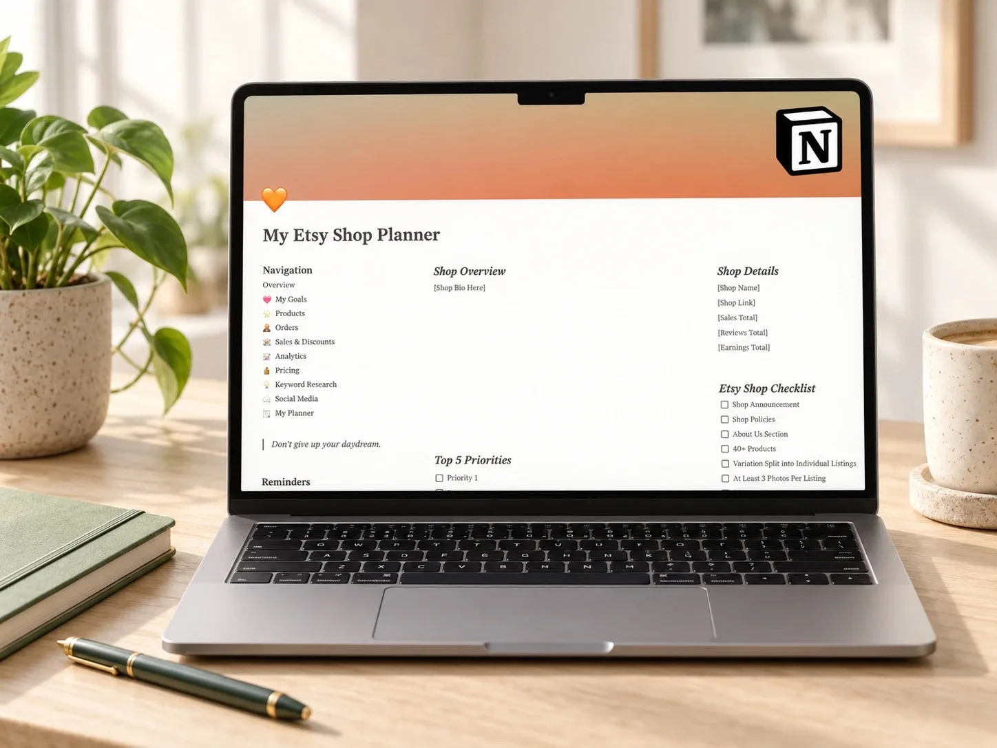 Etsy shop planning dashboard displayed on a laptop on a wooden desk